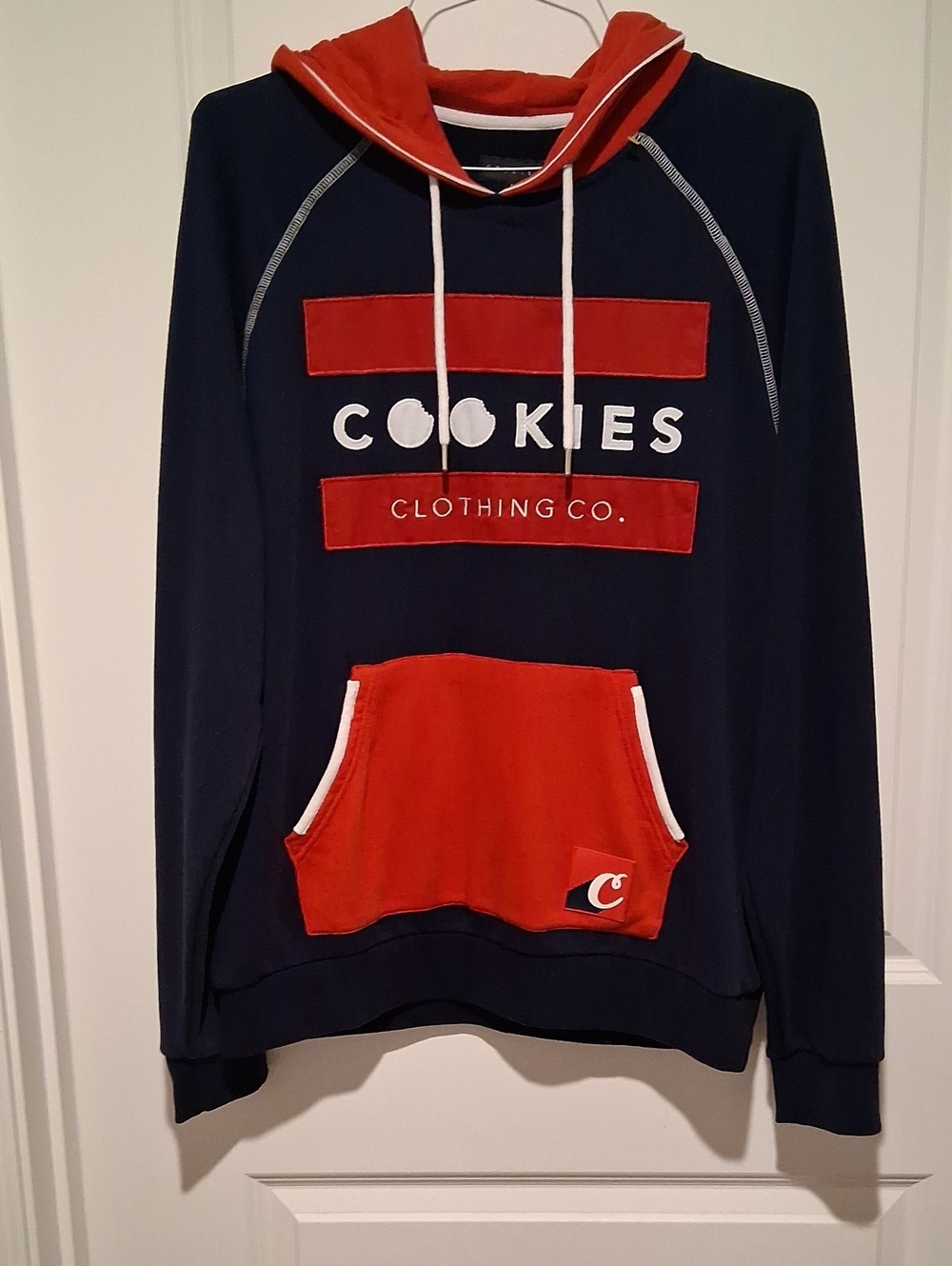 Men's Red/White Hooded Sweatshirt From The Street Wear Brand Is Called Cookies.
